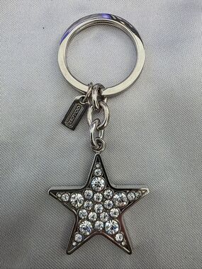 Vintage Coach Pave Crystal Star keychain fob in a silver-tone finish.